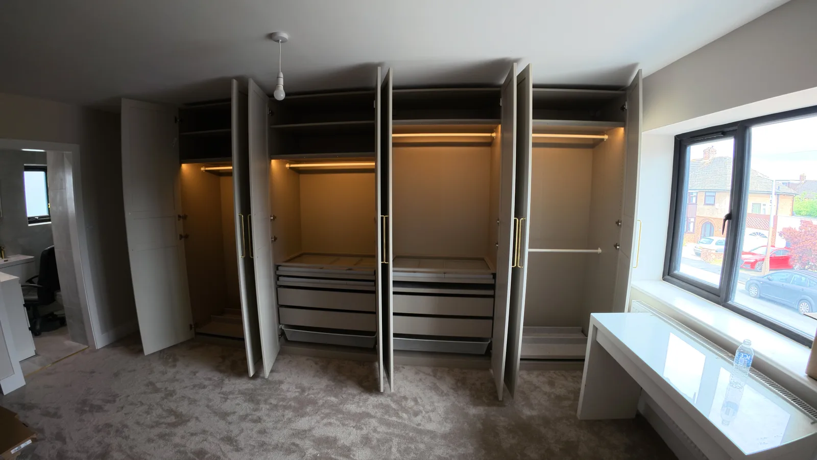 Bespoke fitted wardrobe with integrated lighting